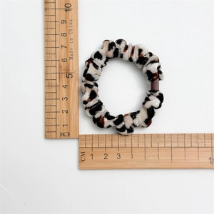 Set of 5 leopard print velvet hair scrunchies with buckles, size measuring 6cm on white background