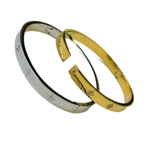 Minimalist 18K gold and silver stainless steel bangles with CNC star engravings