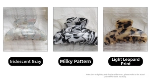Detailed view of large leopard, marble, and acetate hair claws in various patterns