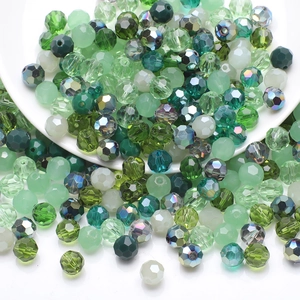 Macro shot of faceted green crystal glass beads for DIY jewelry and necklaces
