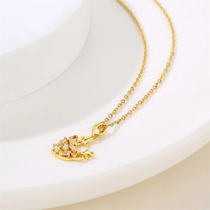 Elegant gold necklace with micro-set zircon reindeer pendant on refined o-chain