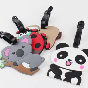 Detailed close-up of cute animal silicone luggage tags with black adjustable buckle straps