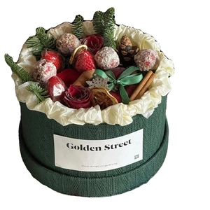 Round green knit texture flower box with roses and strawberries for Christmas decor