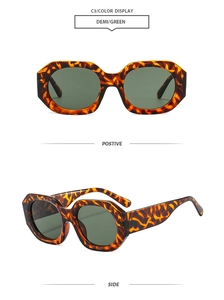 Detail view of stylish demi frames and green lenses on geometric polygon sunglasses