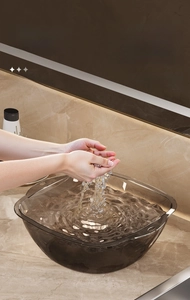 Detailed macro view of the thickened semi-transparent grey basin with anti-splash high walls