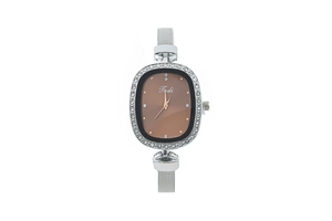 Close-up of oval quartz watch dial with crystal bezel and silver mesh bracelet