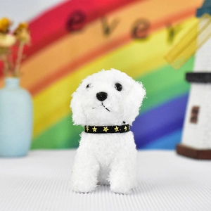 Close-up of a white plush teddy dog keychain with a cute star-studded collar accessory.