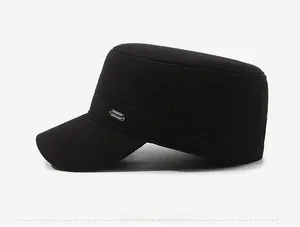 Detail of side view with metal Fashion logo on black winter cadet hat for men