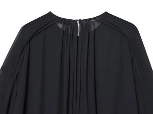Detailed close-up of the back neckline and shoulder cut of a black chiffon blouse