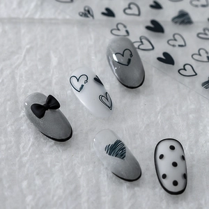 Minimalist matte nail stickers featuring black bows, hearts and polka dots patterns