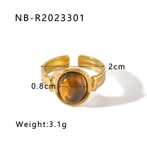 Detail of vintage gold ring featuring tiger eye stone and dimensions showing 2cm inner diameter