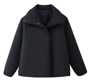 Detail of matte black windproof puffer jacket showing stand collar and metal button fastener