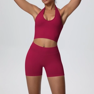 Breathable ribbed sports set featuring halter neck bra and high waist shorts in deep carmine