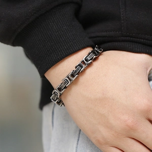 Close-up of vintage Byzantine chain bracelet in stainless steel on a male wrist