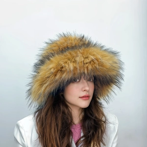 Close-up of fluffy faux fur hat in brown and yellow with thick punk style texture