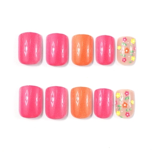 Short square press-on nails featuring cute hand-painted floral patterns on a pink base