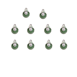 Macro detail of ten green enamel shell pendants with pearls and top hanging rings