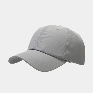 Close-up of light gray quick-dry baseball cap with reinforced stitching on the brim