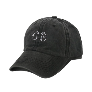 Vintage washed charcoal cotton baseball cap featuring minimalist white penguin embroidery