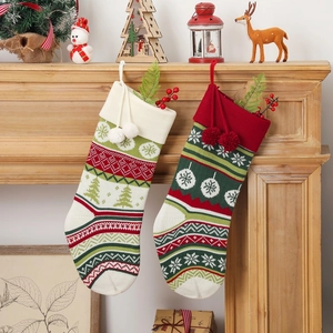 Knitted Christmas stockings with Nordic snowflake patterns hanging on festive fireplace