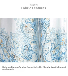 Detailed view of blue paisley print fabric on white long dress with smooth texture