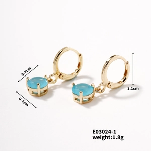 Detailed view of gold earrings featuring light blue gemstones with size dimensions