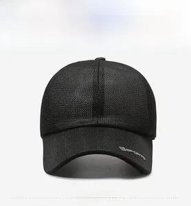 Detailed close-up of a black breathable mesh sports cap with grey logo and curved brim
