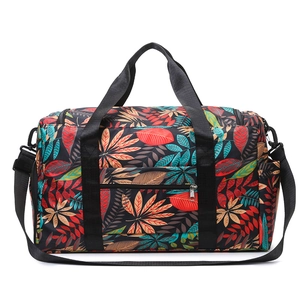 Large travel tote bag with vibrant leaf pattern and adjustable shoulder strap for gym