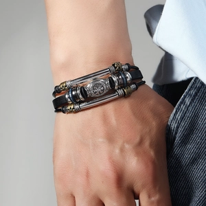 Vintage multi-layer leather bracelet for men featuring metallic beads and charms