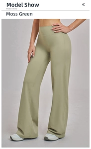 Detail of high waisted flared yoga pants in moss green quick-dry fabric for women