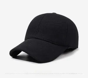 Detail of winter baseball cap showing side SPORT metal logo and warm thick black fabric