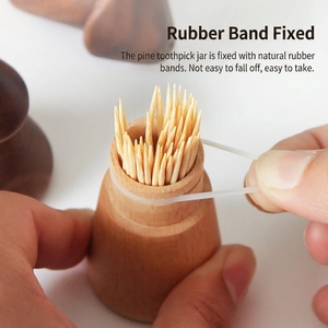 Minimalist walnut wood toothpick holder with rubber ring for stability and storage