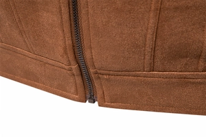 Detailed macro view of the brown suede jacket hem with precise double-row stitching and zipper
