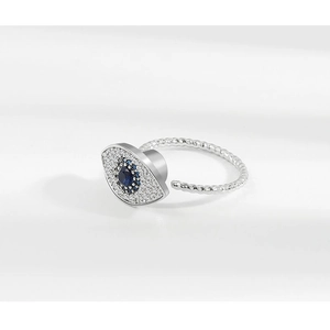 Detailed close-up of S925 sterling silver evil eye spinner ring with blue crystals