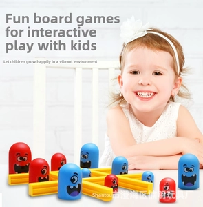 Smiling girl playing monster-themed tic-tac-toe nesting strategy game for kids