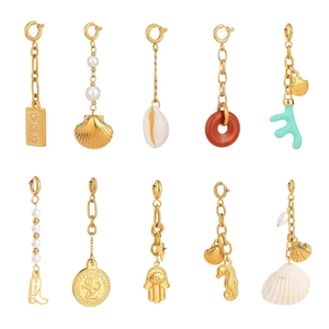 Set of 10 gold stainless steel bikini charms including pearl, shell and starfish designs