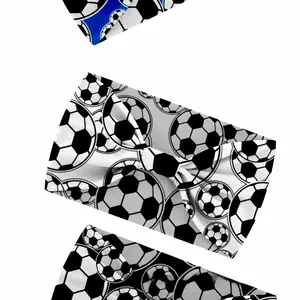 Detail showing elastic sports headbands with dense football patterns and blue accents