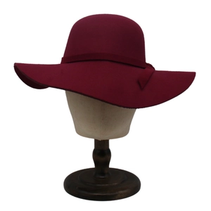 Detail of the high-quality burgundy wool felt hat with ribbon bow and wide brim