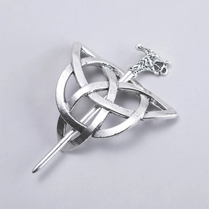 Silver Celtic knot brooch with dragon head pin in a vintage metal finish from top view