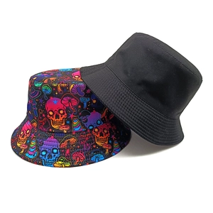Reversible bucket hat with black side and colorful skull mushroom print for sun protection