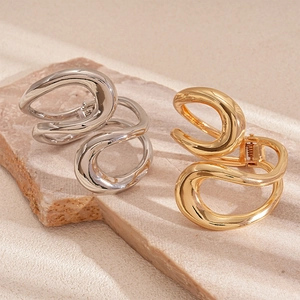 Minimalist irregular geometric crossover metal hair claw in polished gold and silver finishes
