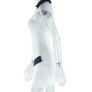 Detail of white slim-fit sleeveless dress featuring black contrast collar and side trim