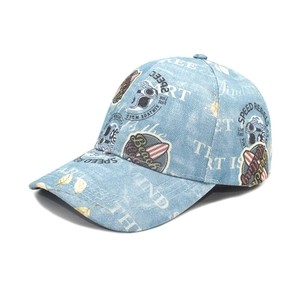 Vintage light blue washed denim baseball cap with Speed Rebels surf print at 45-degree angle