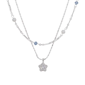 Double-layered silver star pendant necklace with blue crystals and sparkling zircons