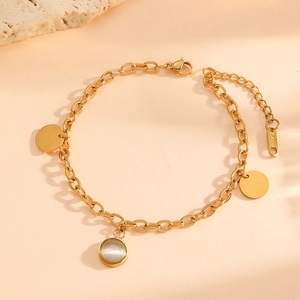 Gold stainless steel chain bracelet featuring opal pendant and polished metal charms