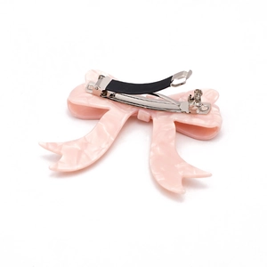 Elegant pink acetate bow hair clip with glossy finish and durable metal spring clamp