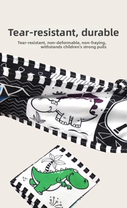 Detail of tear-resistant baby cloth book with high-contrast black white and dinosaur patterns