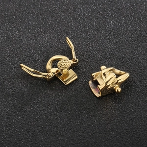 Macro view of gold-plated stainless steel folding clasps for Cuban link chain bracelets