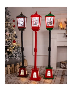 Detailed view of festive Christmas street lamp with glowing lights and snowy effect decor