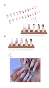 Detail of long coffin press-on nails with 3D floral accents and pink gradient art